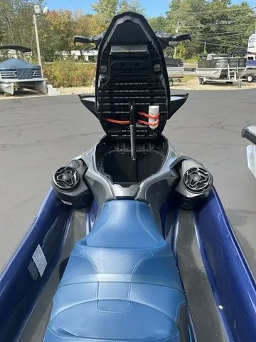 Slide: The Image of 2024 Sea-Doo GTX with open storage compartment on parking lot. - 5