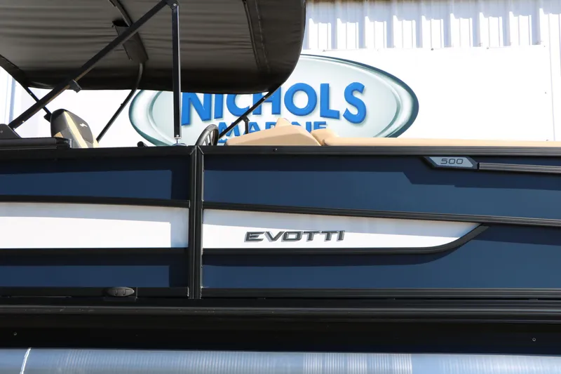 Slide: The Image of 2026 Evotti 525 QL Tri-Toon boat at Nichols Marine dealership. - 12