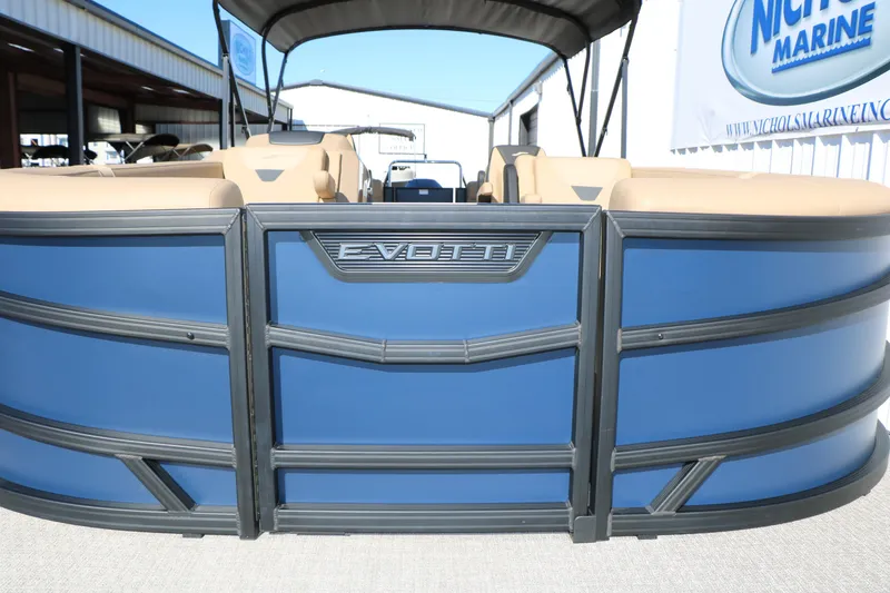 Slide: The Image of 2026 Evotti 525 QL Tri-Toon boat with blue exterior and beige seating. - 13