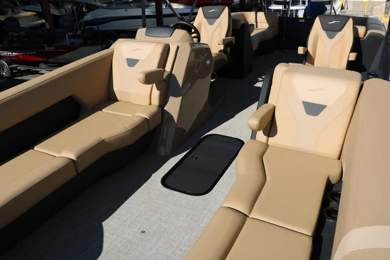 Slide: The Image of Luxurious interior of 2026 Evotti 525 QL Tri-Toon boat with beige seating. - 17