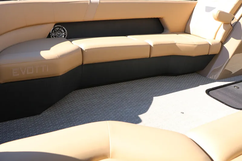 Slide: The Image of Luxurious seating on 2026 Evotti 525 QL Tri-Toon boat, featuring tan upholstery and sleek design. - 18