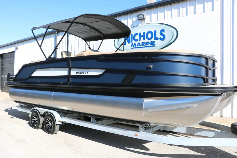 Slide: The Image of 2026 Evotti 525 QL Tri-Toon boat on trailer at Nichols Marine dealership. - 2