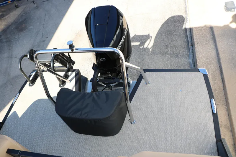 Slide: The Image of Rear view of 2026 Evotti 525 QL Tri-Toon boat with Mercury outboard motor. - 23