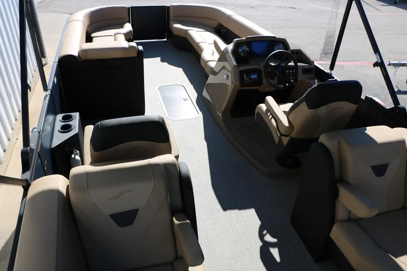 Slide: The Image of 2026 Evotti 525 QL Tri-Toon boat interior with luxurious seating and modern dashboard. - 24