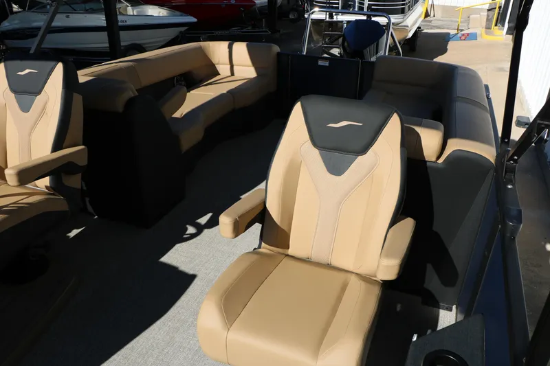 Slide: The Image of 2026 Evotti 525 QL Tri-Toon interior with luxurious tan seating and modern design. - 34