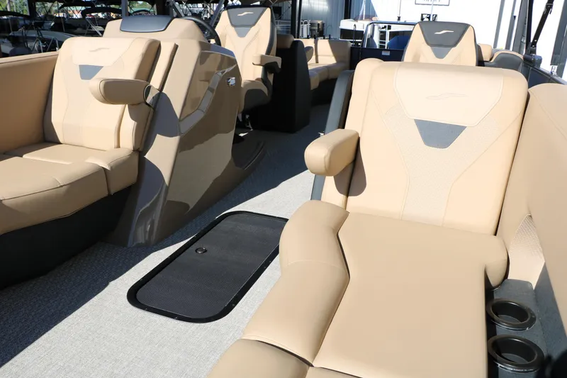 Slide: The Image of Luxurious seating on 2026 Evotti 525 QL Tri-Toon boat, featuring beige upholstery and cup holders. - 35