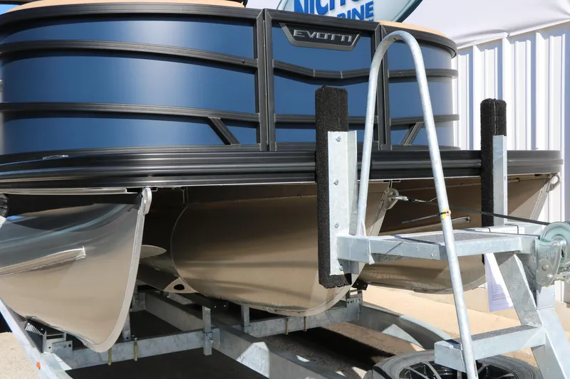 Slide: The Image of 2026 Evotti 525 QL Tri-Toon boat on trailer, showcasing sleek design and sturdy construction. - 4