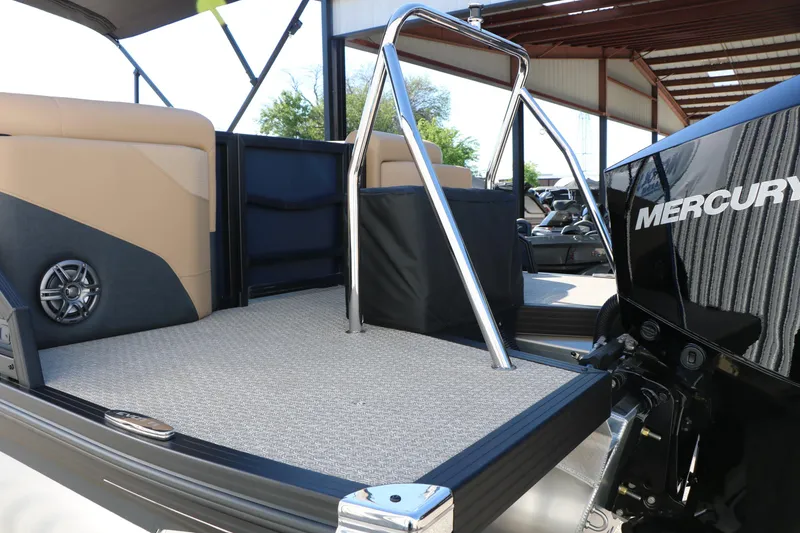 Slide: The Image of 2026 Evotti 525 QL Tri-Toon boat interior with Mercury engine, featuring sleek design and seating. - 45