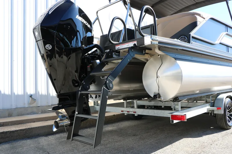 Slide: The Image of 2026 Evotti 525 QL Tri-Toon boat with Mercury engine and ladder on trailer. - 47