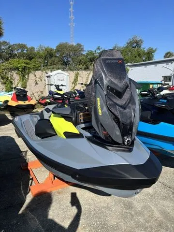 Slide: The Image of 2026 Sea-Doo RXP-X jet ski in an outdoor storage area. - 3