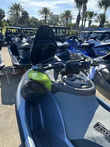 Slide: The Image of 2026 Sea-Doo RXP-X jet ski on a sunny parking lot. - 4