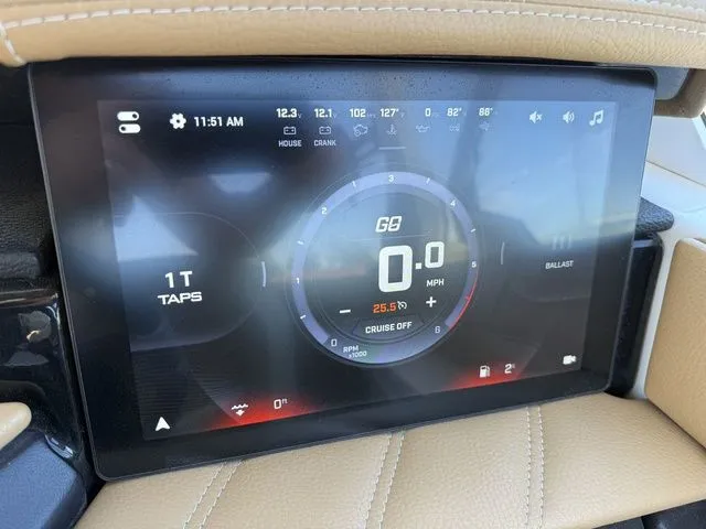 Slide: The Image of Tigé 25ZX 2025 digital dashboard displaying speed and controls. - 13