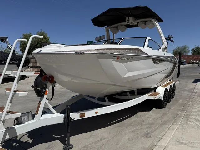 Slide: The Image of 2025 Tigé 25ZX boat on trailer, side view. - 5