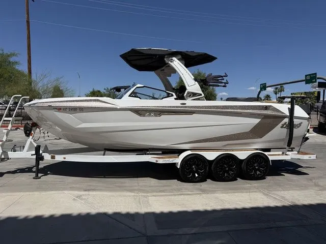 Slide: The Image of 2025 Tigé 25ZX boat on trailer, side view. - 6
