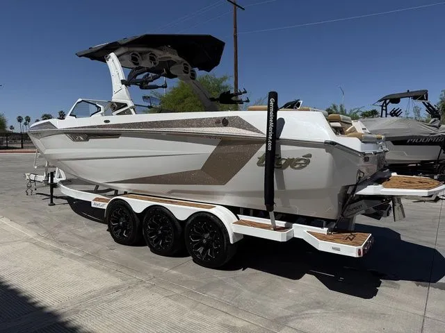 Slide: The Image of 2025 Tigé 25ZX boat on trailer, side view. - 7