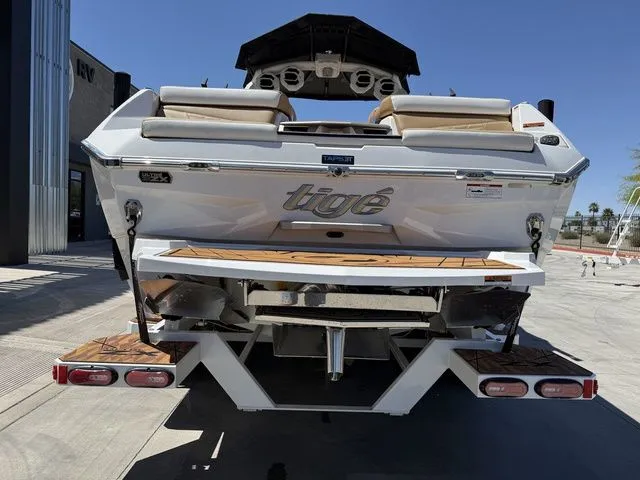 Slide: The Image of Rear view of 2025 Tigé 25ZX boat on a trailer. - 8