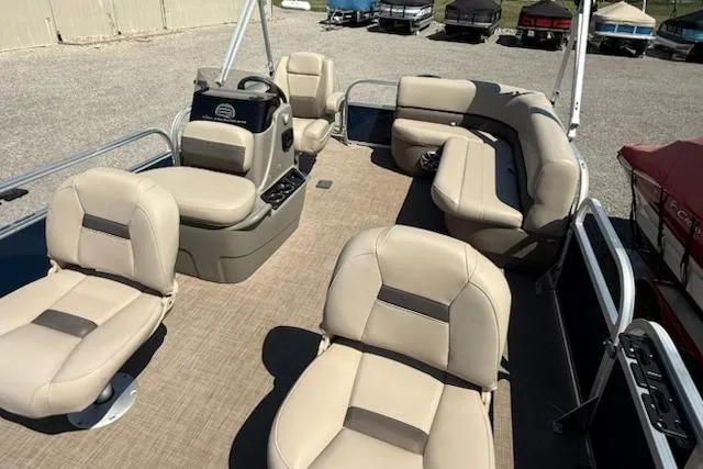 Slide: The Image of 2024 Sun Tracker Bass Buggy 16 XL pontoon boat with beige seating and spacious layout. - 7