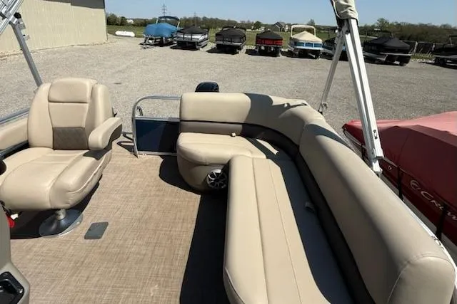 Slide: The Image of 2024 Sun Tracker Bass Buggy 16 XL pontoon boat with beige seating and spacious deck. - 8
