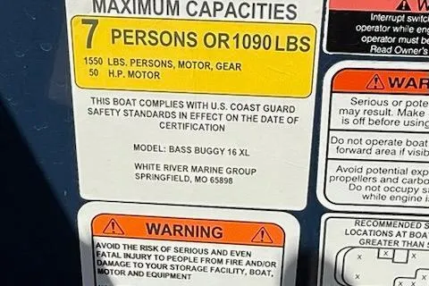 Slide: The Image of 2024 Sun Tracker Bass Buggy 16 XL capacity and safety warnings label. - 9