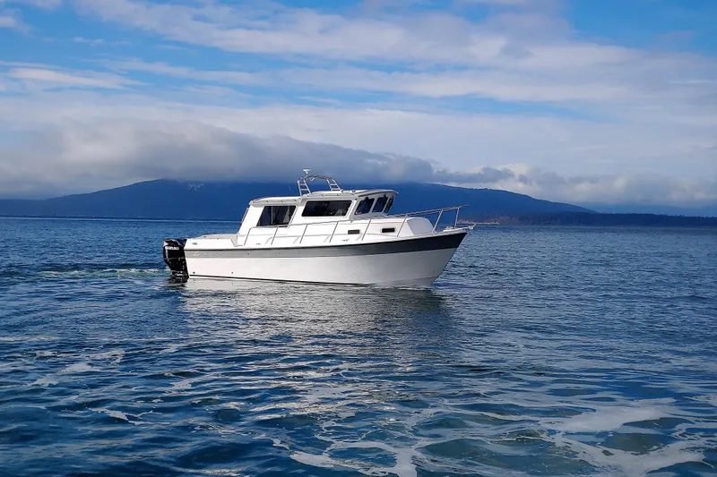The Image of 2026 Sea Sport Voyager 3000 cruising on calm waters under a blue sky. - 1