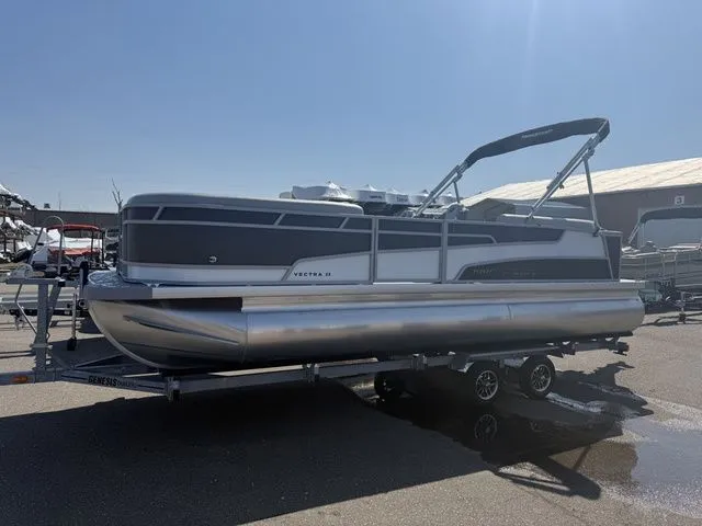 The Image of 2026 Princecraft Vectra 23 QL pontoon boat on trailer outdoors. - 1