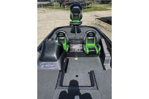 Slide: The Image of 2026 Blazer 595 Pro Elite boat with green and black seating, docked outdoors. - 10