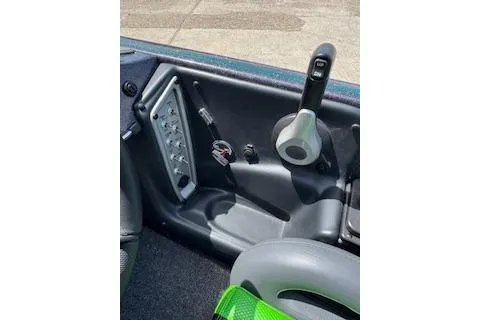 Slide: The Image of 2026 Blazer 595 Pro Elite boat interior with control panel and throttle lever. - 11