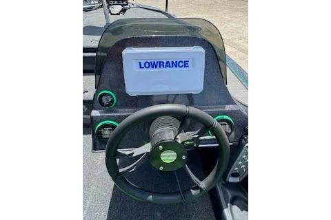Slide: The Image of 2026 Blazer 595 Pro Elite boat dashboard with Lowrance display and steering wheel. - 12