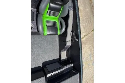 Slide: The Image of Interior of 2026 Blazer 595 Pro Elite with green-accented seats and control panel. - 15