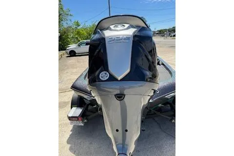 Slide: The Image of 2026 Blazer 595 Pro Elite boat, rear view, parked outdoors. - 3