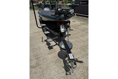 Slide: The Image of 2026 Blazer 595 Pro Elite boat on trailer, parked outdoors. - 6