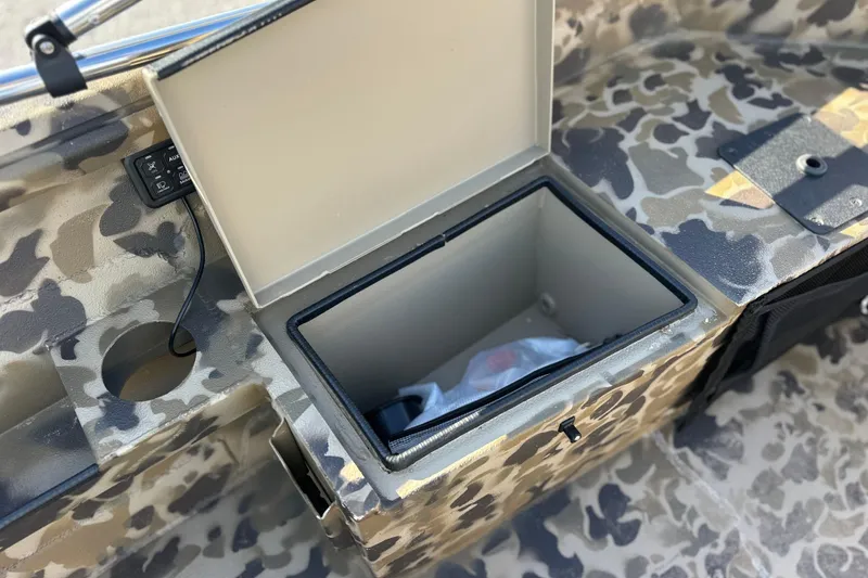 Slide: The Image of Camouflage interior of 2026 Excel 1751 Viper F4 boat with open storage compartment. - 15