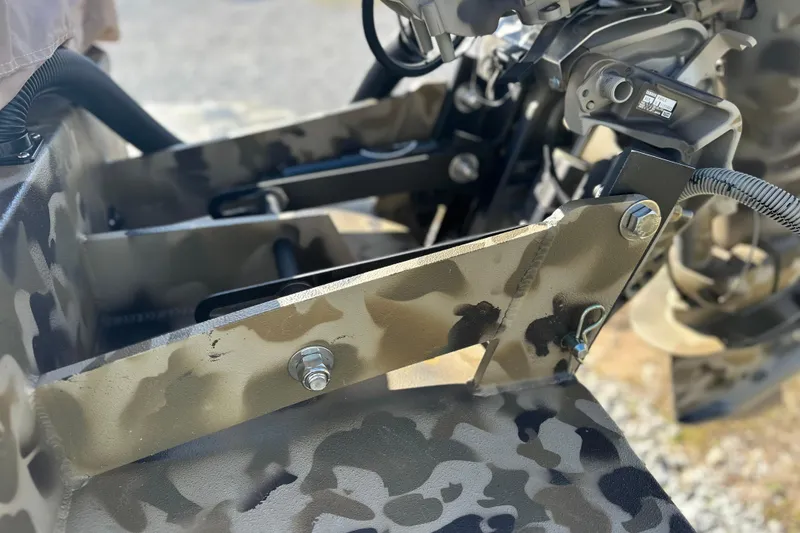 Slide: The Image of Camouflage-patterned Excel 1751 Viper F4 boat detail, showcasing robust construction, 2026 model. - 19