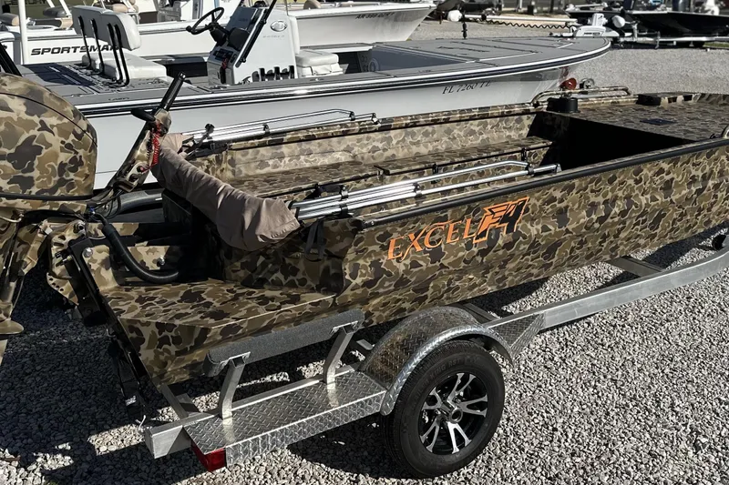 Slide: The Image of Camouflage-patterned 2026 Excel 1751 Viper F4 boat on a trailer in a lot. - 21