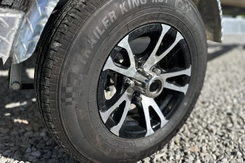 Slide: The Image of Close-up of a 2026 Excel 1751 Viper F4 wheel on gravel surface. - 4