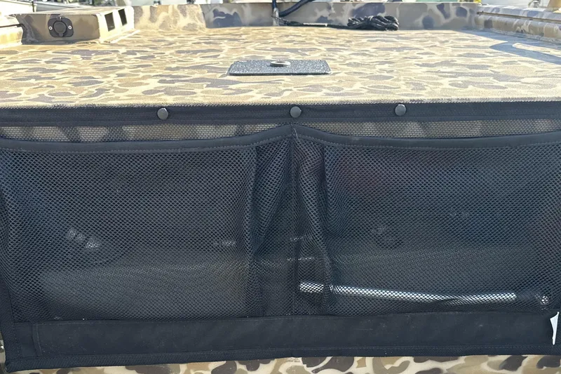Slide: The Image of Camouflage-patterned deck of 2026 Excel 1751 Viper F4 boat with mesh storage pocket. - 9