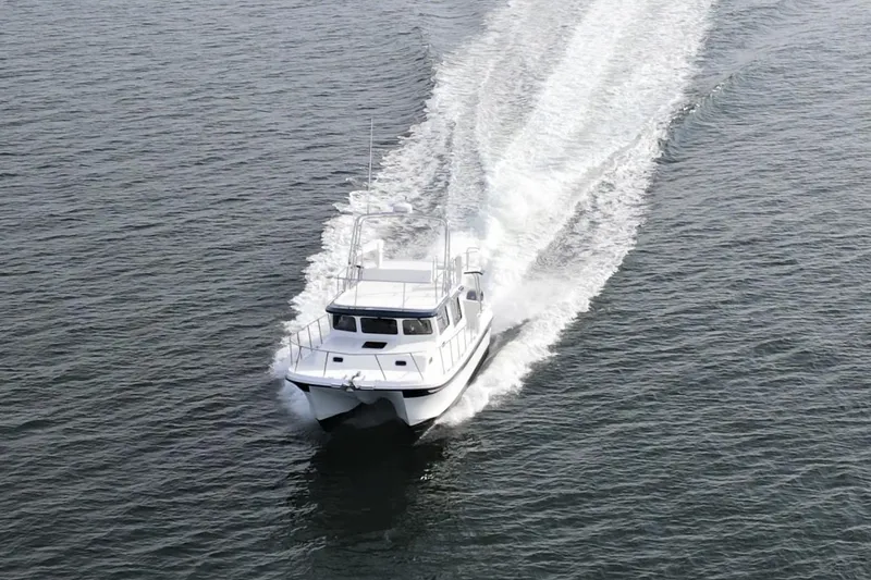 The Image of 2026 Sea Sport Pacific 3200 cruising on open water, creating a wake. - 1