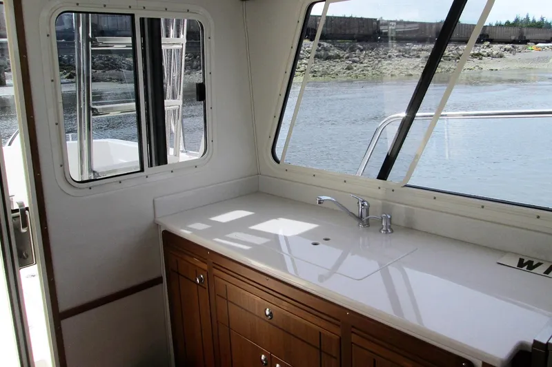 Slide: The Image of Interior view of 2026 Sea Sport Pacific 3200 boat with sink and window. - 17