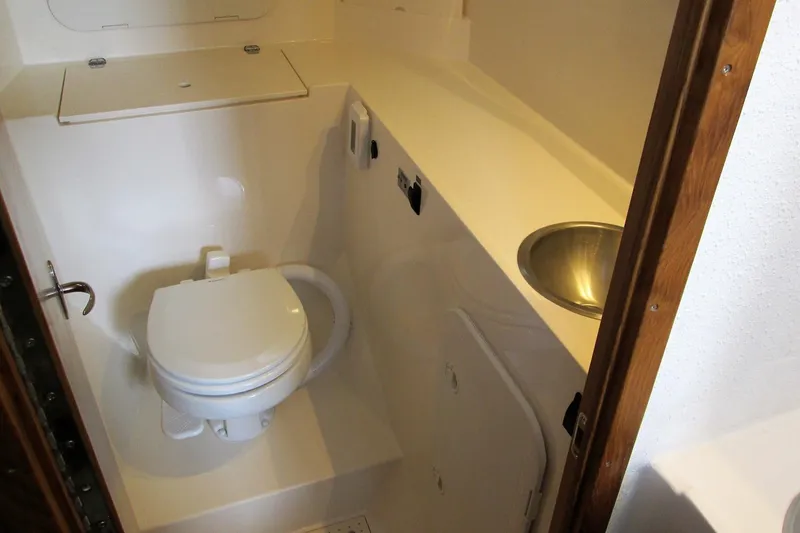 Slide: The Image of Compact bathroom in 2026 Sea Sport Pacific 3200 boat with toilet and sink. - 21
