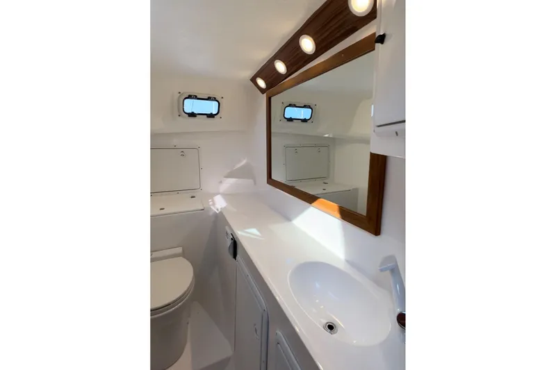 Slide: The Image of Modern bathroom in 2026 Sea Sport Pacific 3200 boat with mirror and porthole window. - 8