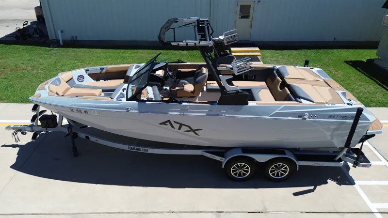 Slide: The Image of 2024 ATX TYPE S boat on trailer, side view. - 11