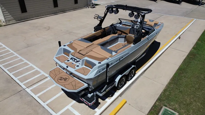 Slide: The Image of 2024 ATX TYPE S boat on trailer, modern features. - 14