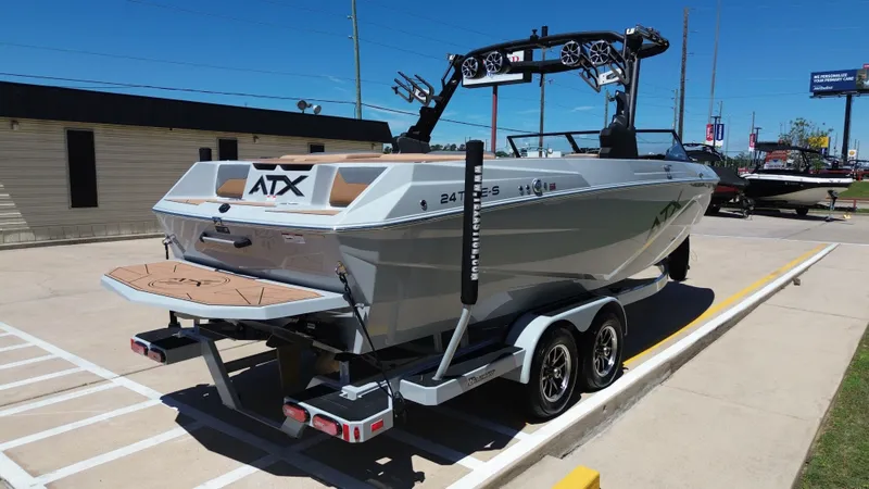Slide: The Image of 2024 ATX TYPE S boat on trailer parked outdoors. - 5