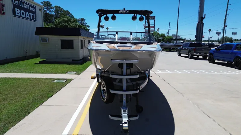 Slide: The Image of 2024 ATX TYPE S boat on trailer in parking lot. - 8