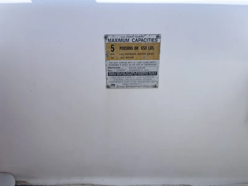 Slide: The Image of Capacity label for Boston Whaler 130 Sport 2002 boat. - 25