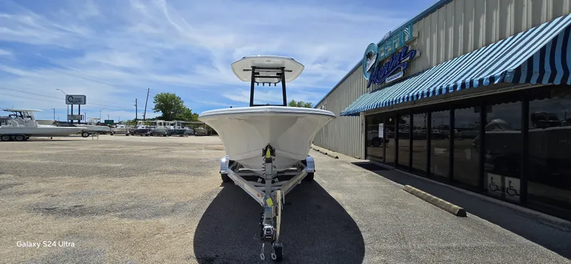 Slide: The Image of 2026 Tidewater 220 LXF boat parked in front of a building. - 13