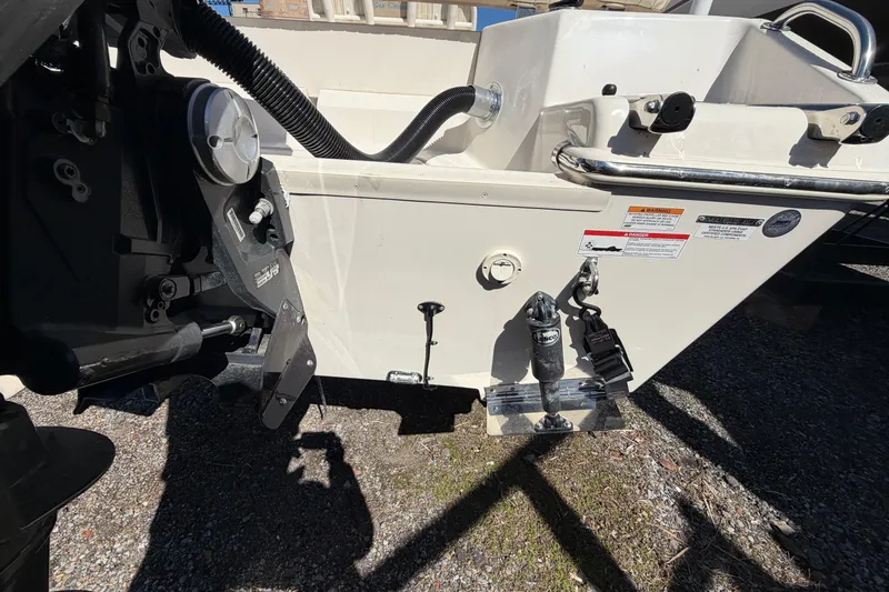 Slide: The Image of 2017 Sea Chaser 24 HFC boat stern with motor and safety labels. - 14