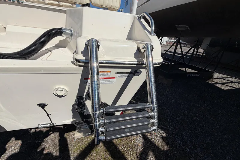 Slide: The Image of 2017 Sea Chaser 24 HFC boat ladder and stern details in sunlight. - 15
