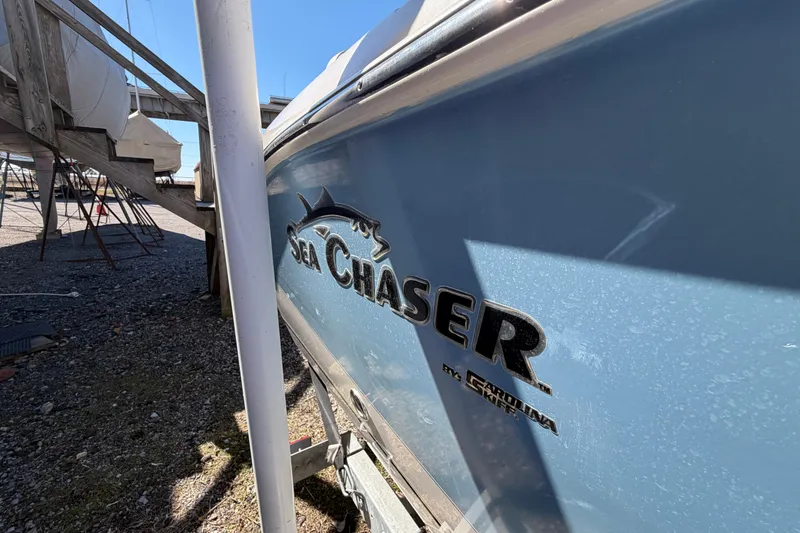 Slide: The Image of 2017 Sea Chaser 24 HFC boat in dry dock, side view with logo. - 16