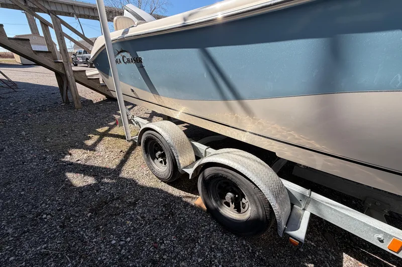 Slide: The Image of 2017 Sea Chaser 24 HFC boat on trailer, parked outdoors in sunlight. - 17